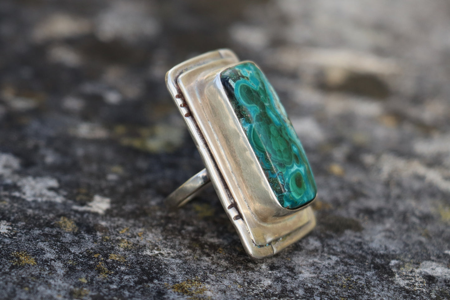 Rear and side angle of a Chrysocolla Malachite ring in sterling silver, revealing the craftsmanship of the bezel and band. Natural gemstone jewelry featuring blue-green mineral patterns.
