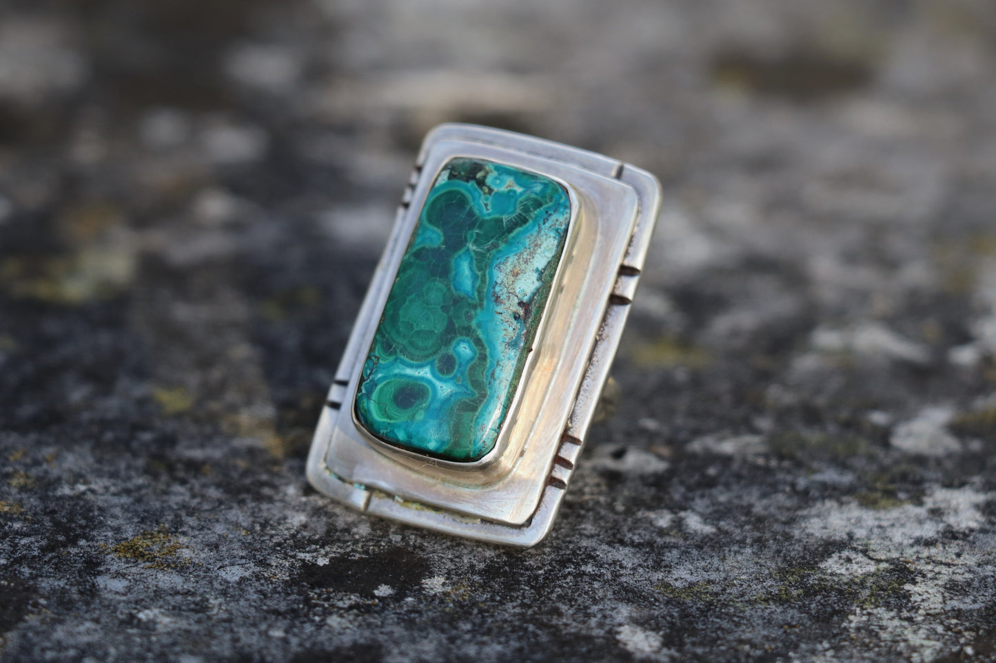Rear and side angle of a Chrysocolla Malachite ring in sterling silver, revealing the craftsmanship of the bezel and band. Natural gemstone jewelry featuring blue-green mineral patterns.