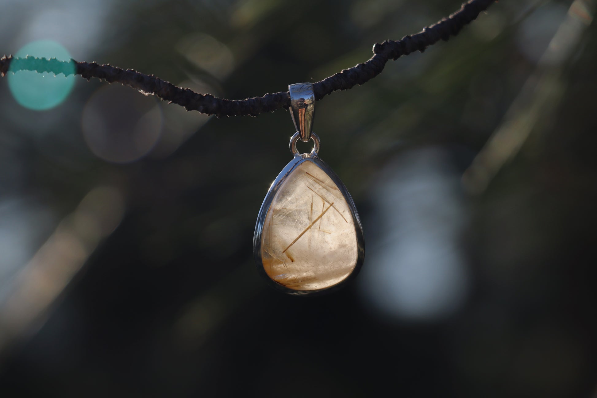 Handcrafted Silver Pendant with Rutilated Quartz. Witchy jewelry for spiritual alignment.