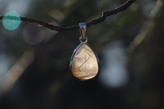 Handcrafted Silver Pendant with Rutilated Quartz. Witchy jewelry for spiritual alignment.