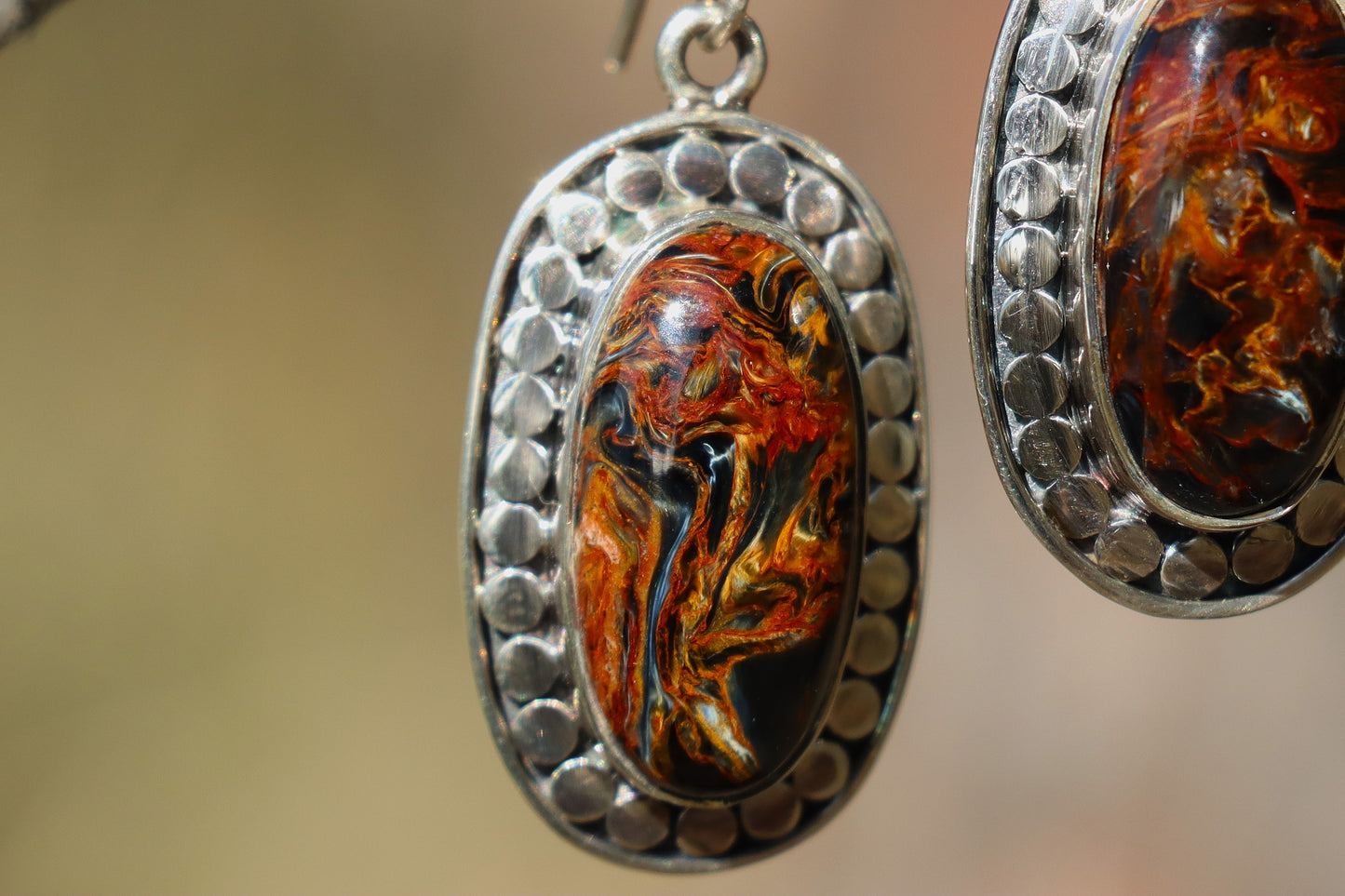 Handcrafted Silver Earrings with blue and gold Pietersite promoting confidence and transformation.