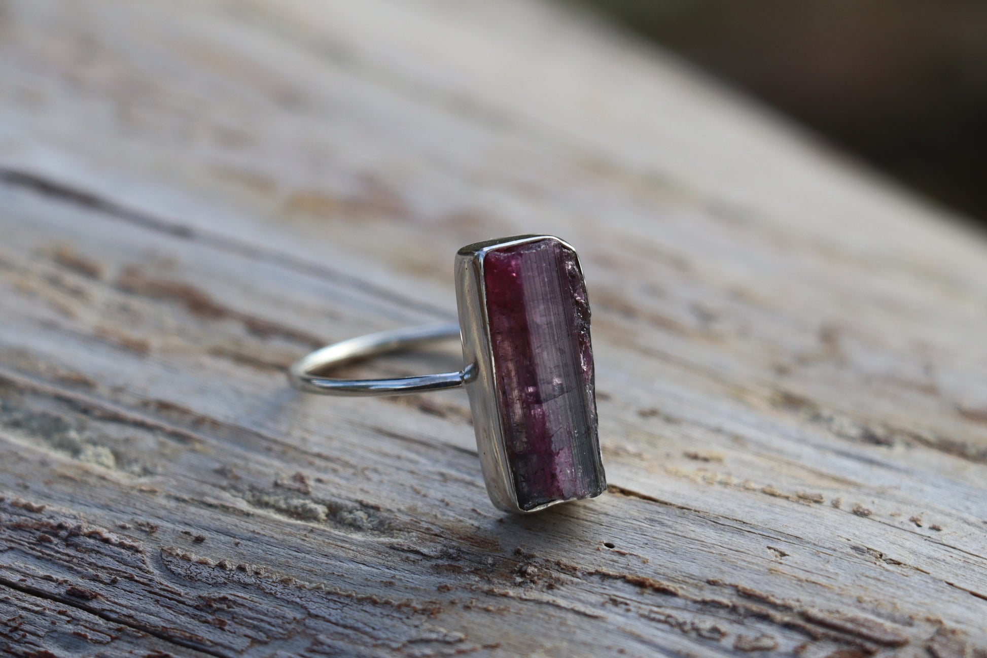 Right side view of the handcrafted Raw Pink Tourmaline Ring, highlighting its unique silver setting for emotional release.