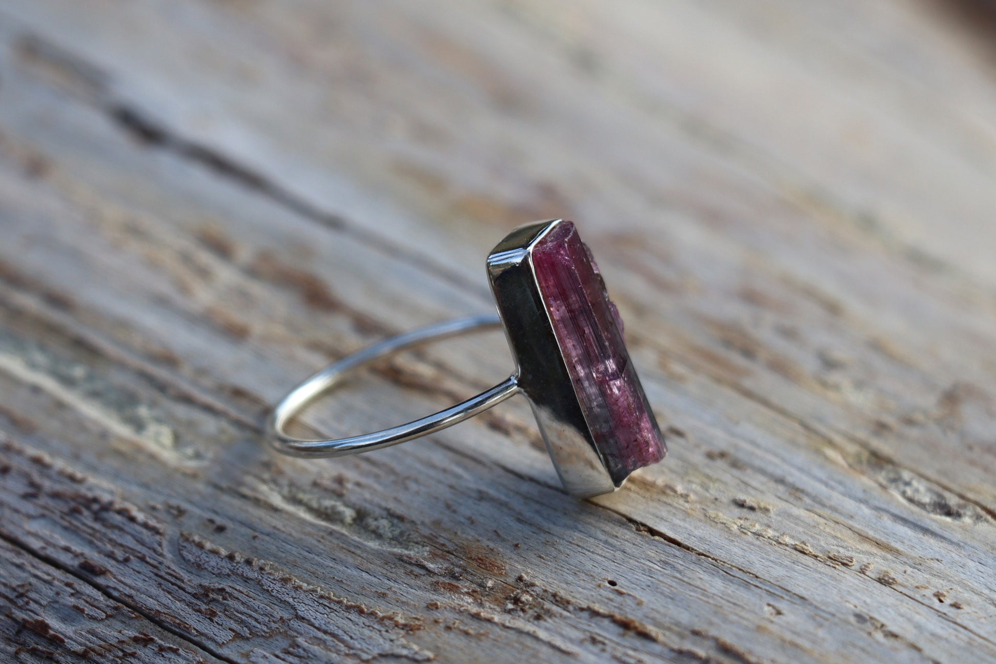 Back right side view of the handcrafted Raw Pink Tourmaline Ring, highlighting its unique silver setting for emotional release.