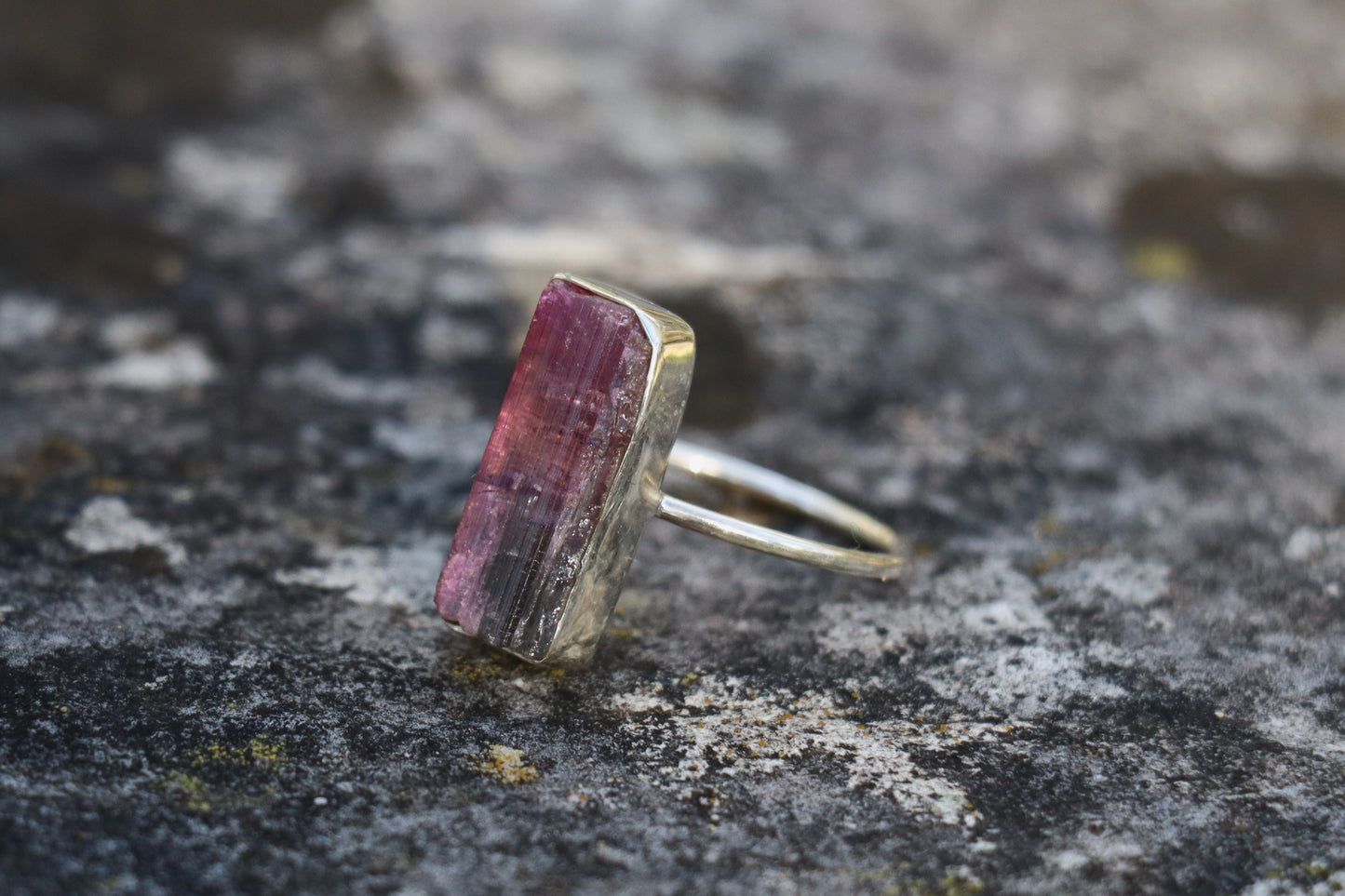 Left side view of the 925 Sterling Silver Pink Tourmaline Ring, showcasing the raw gemstone's natural beauty and support for self-compassion.
