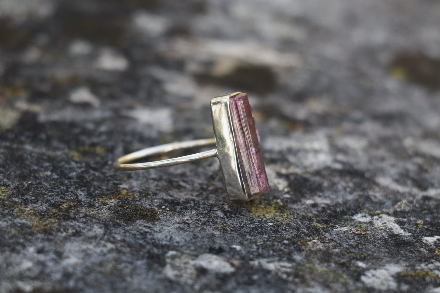 Close-up of the Natural Raw Pink Tourmaline gemstone, revealing its tender pink hues and supporting emotional stability.