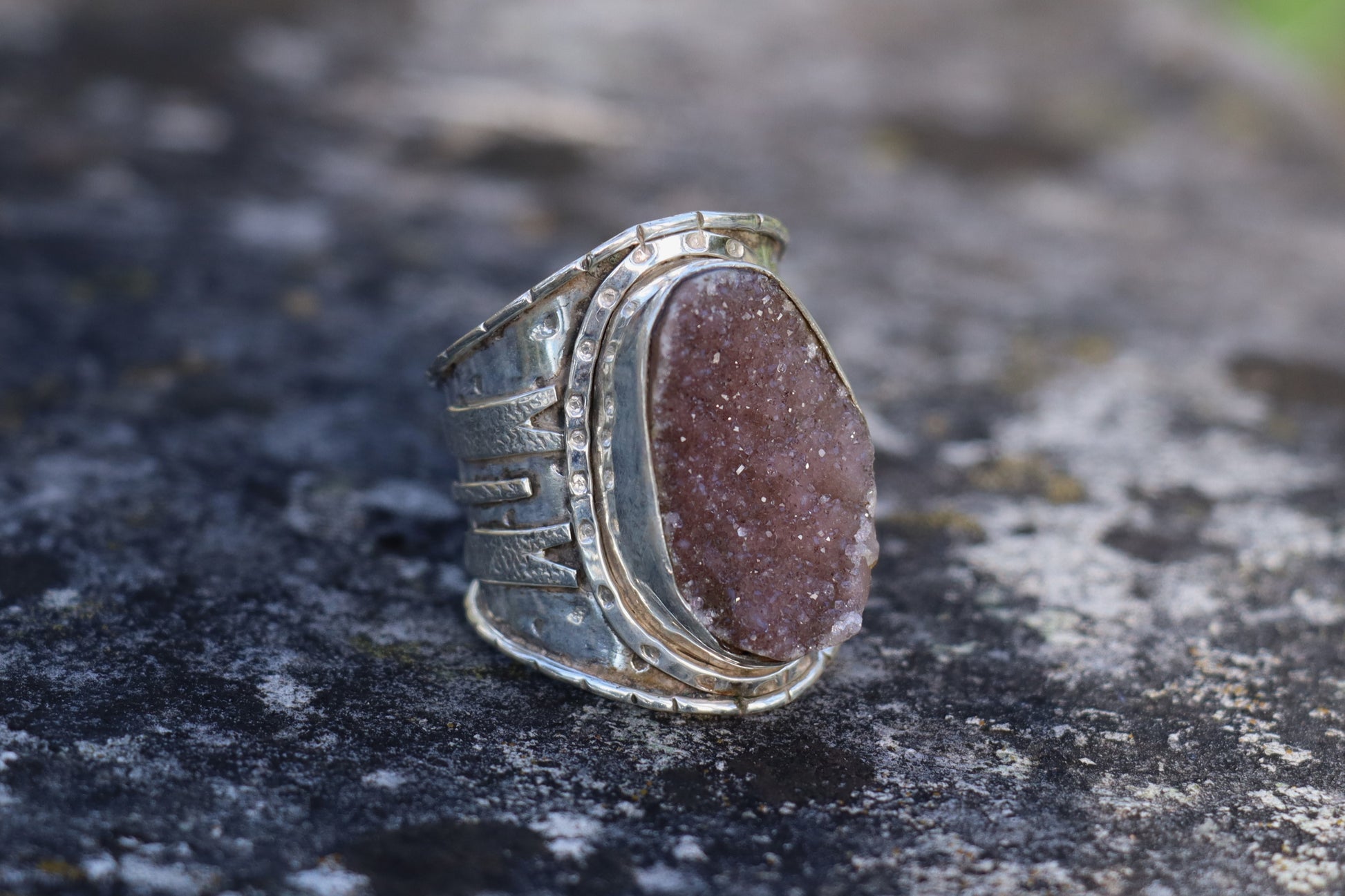 Front view of Purple Druzy statement ring with shimmering crystal surface and artisan silver band, natural druzy quartz jewelry.