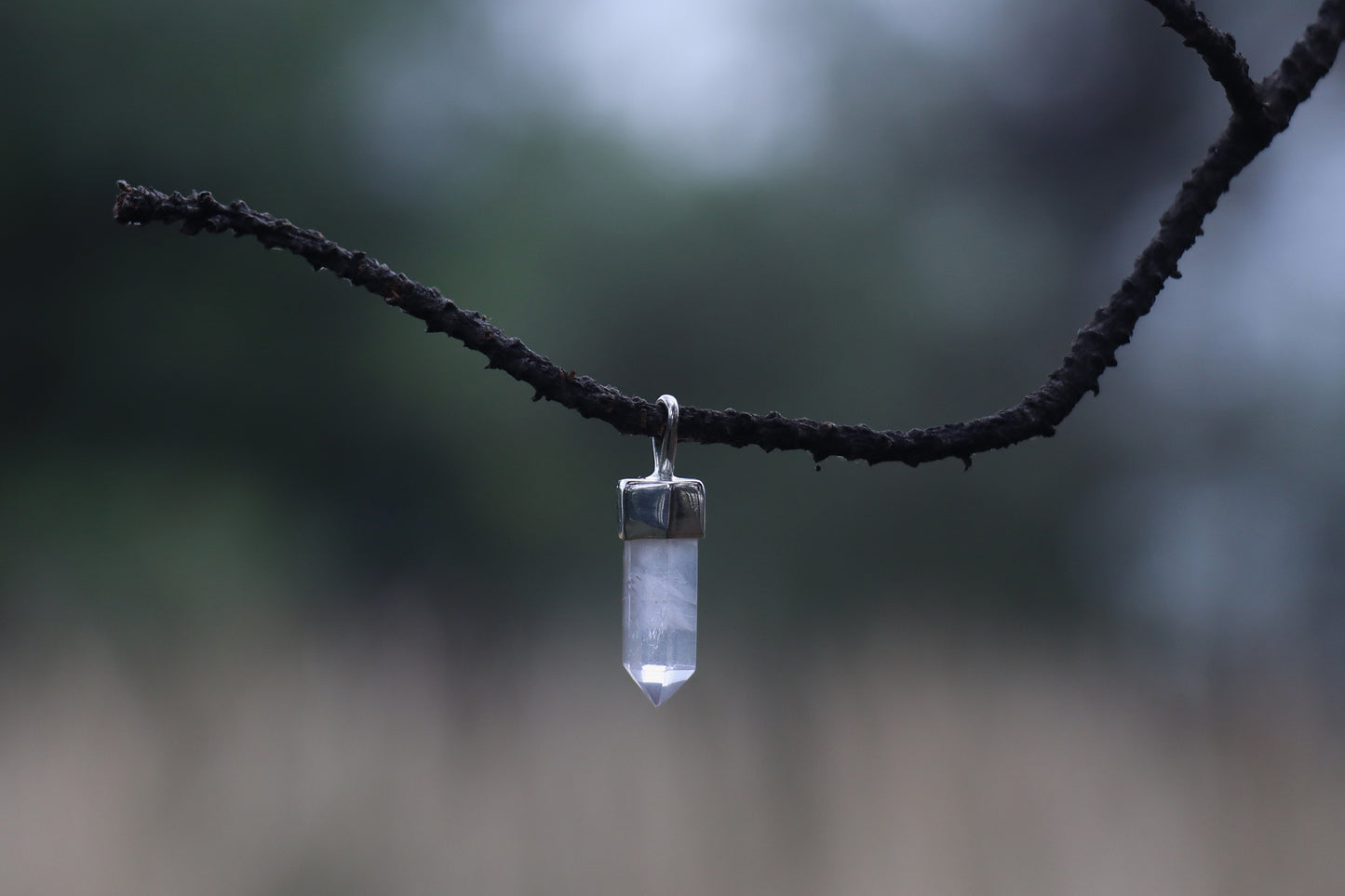 Close up of Quartz Point Pendant. Sun Energy jewelry for Amplifying Intentions and vitality.