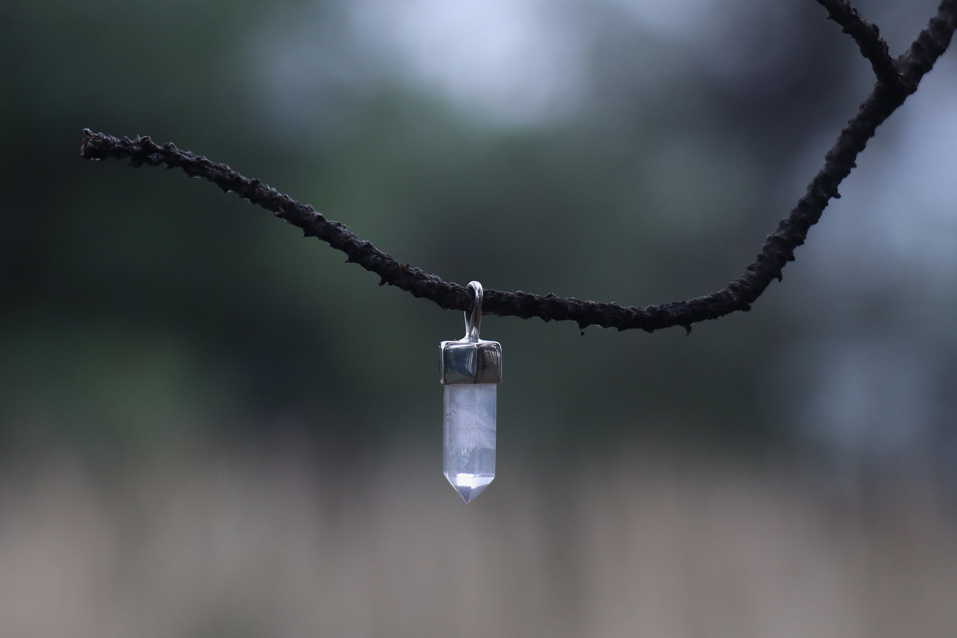 Close up of Quartz Point Pendant. Sun Energy jewelry for Amplifying Intentions and vitality.