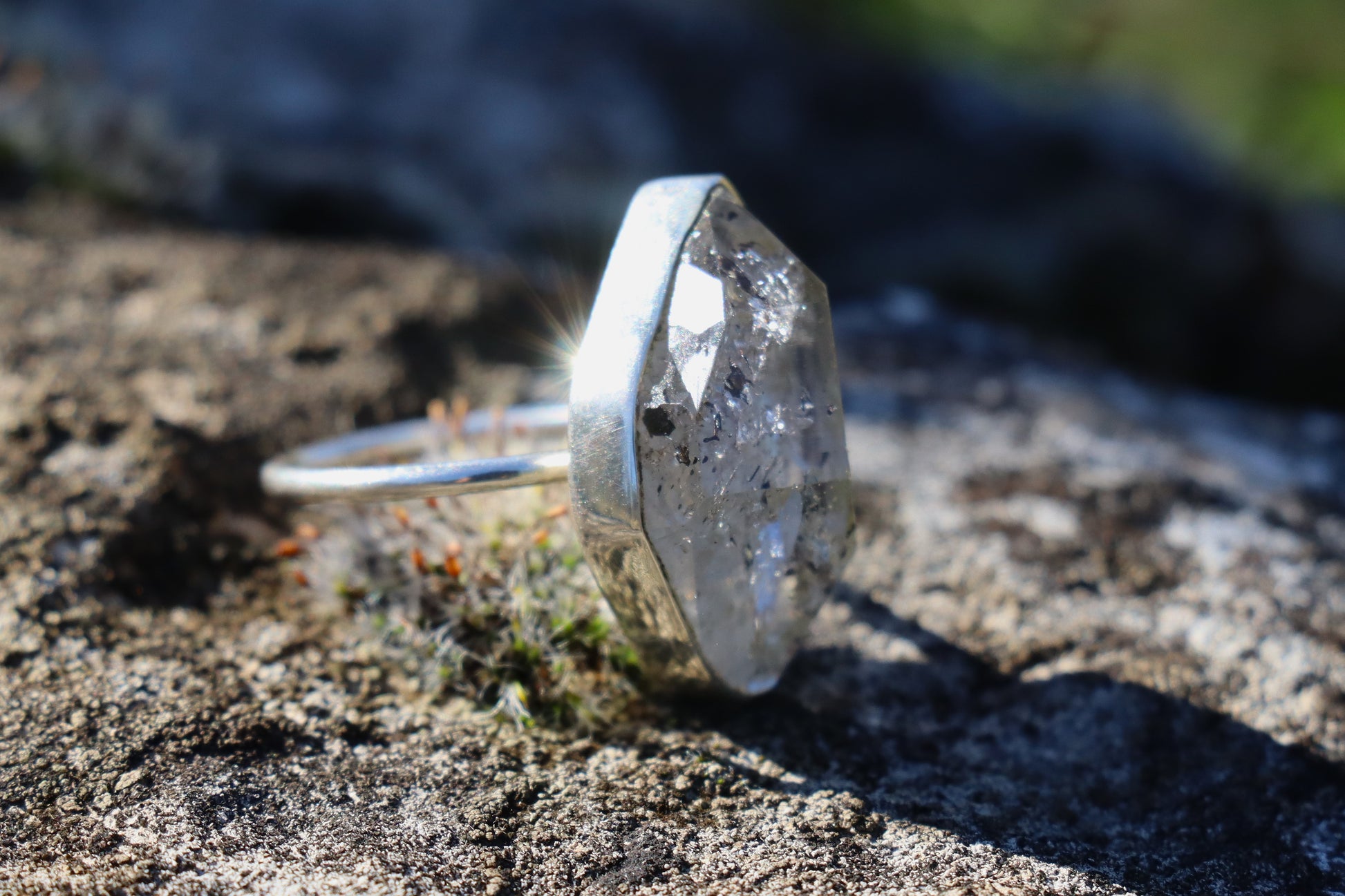 Black rutilated quartz ring in sterling silver. clear quartz with black tourmaline inclusions, aligned with Uranus and Saturn for grounding and insight.