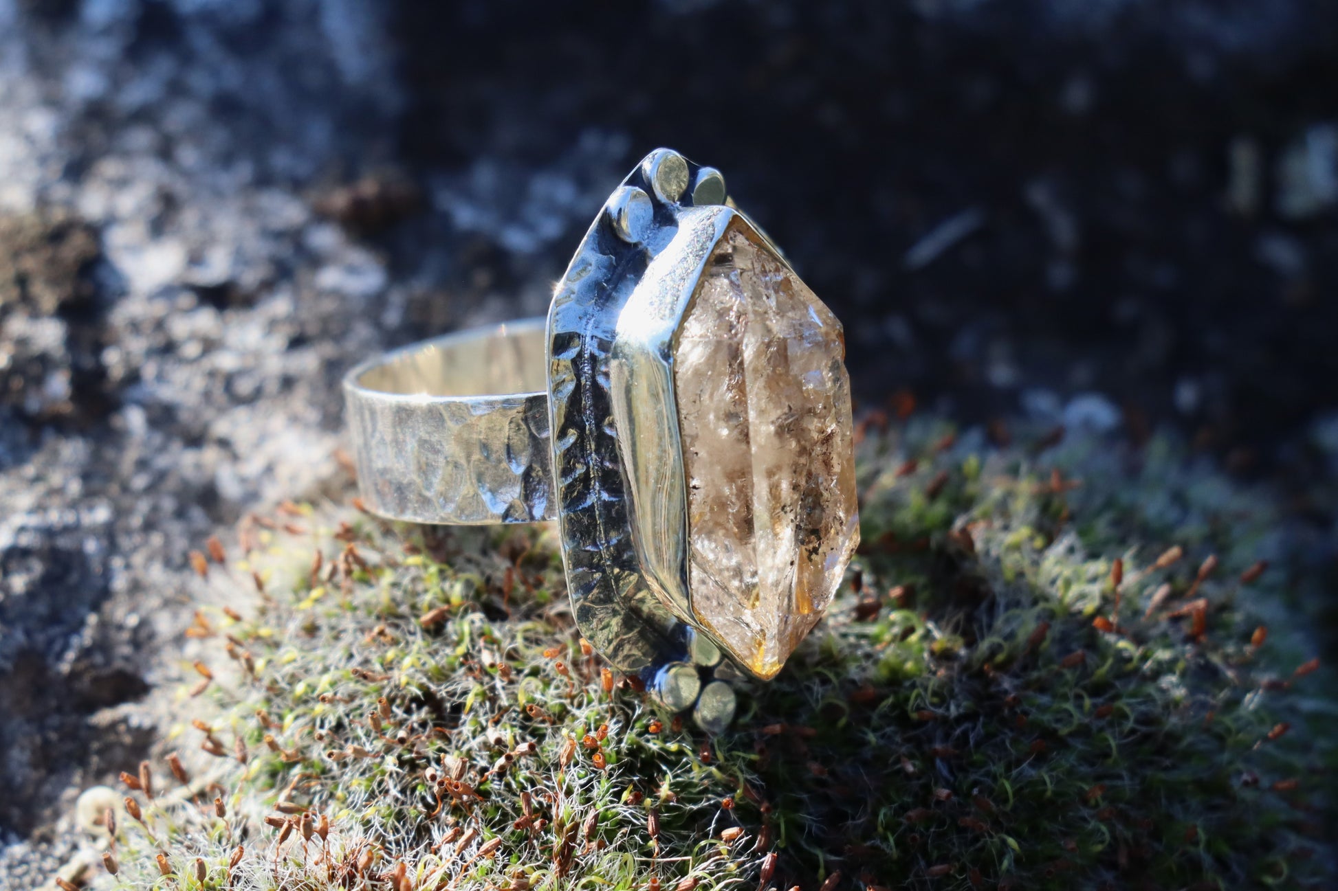 Close-up of the Raw Smoky Quartz gemstone set in 925 Silver. Highlighting its smoky brown color and deep vibrational frequency.