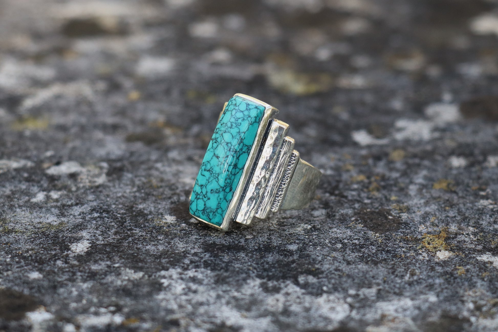 Right side view of the handcrafted Turquoise Ring, highlighting the unique textured silverwork. Amplifies self-expression and courageous communication.