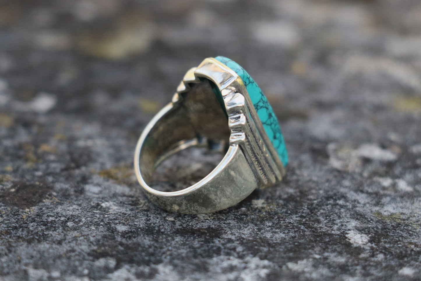 Back right side view of the handcrafted Turquoise Ring, highlighting the unique textured silverwork. Amplifies self-expression and courageous communication.