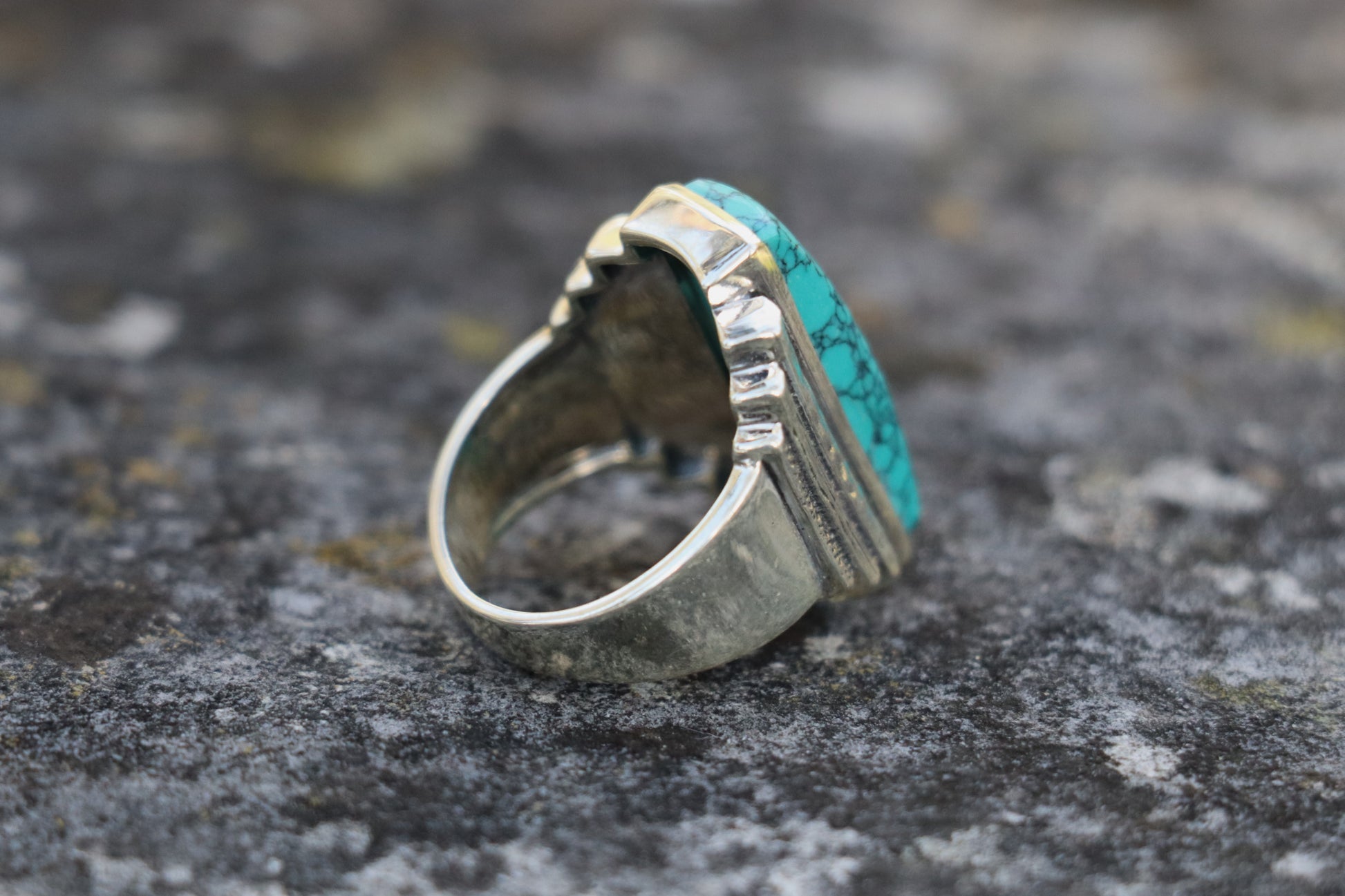 Back right side view of the handcrafted Turquoise Ring, highlighting the unique textured silverwork. Amplifies self-expression and courageous communication.