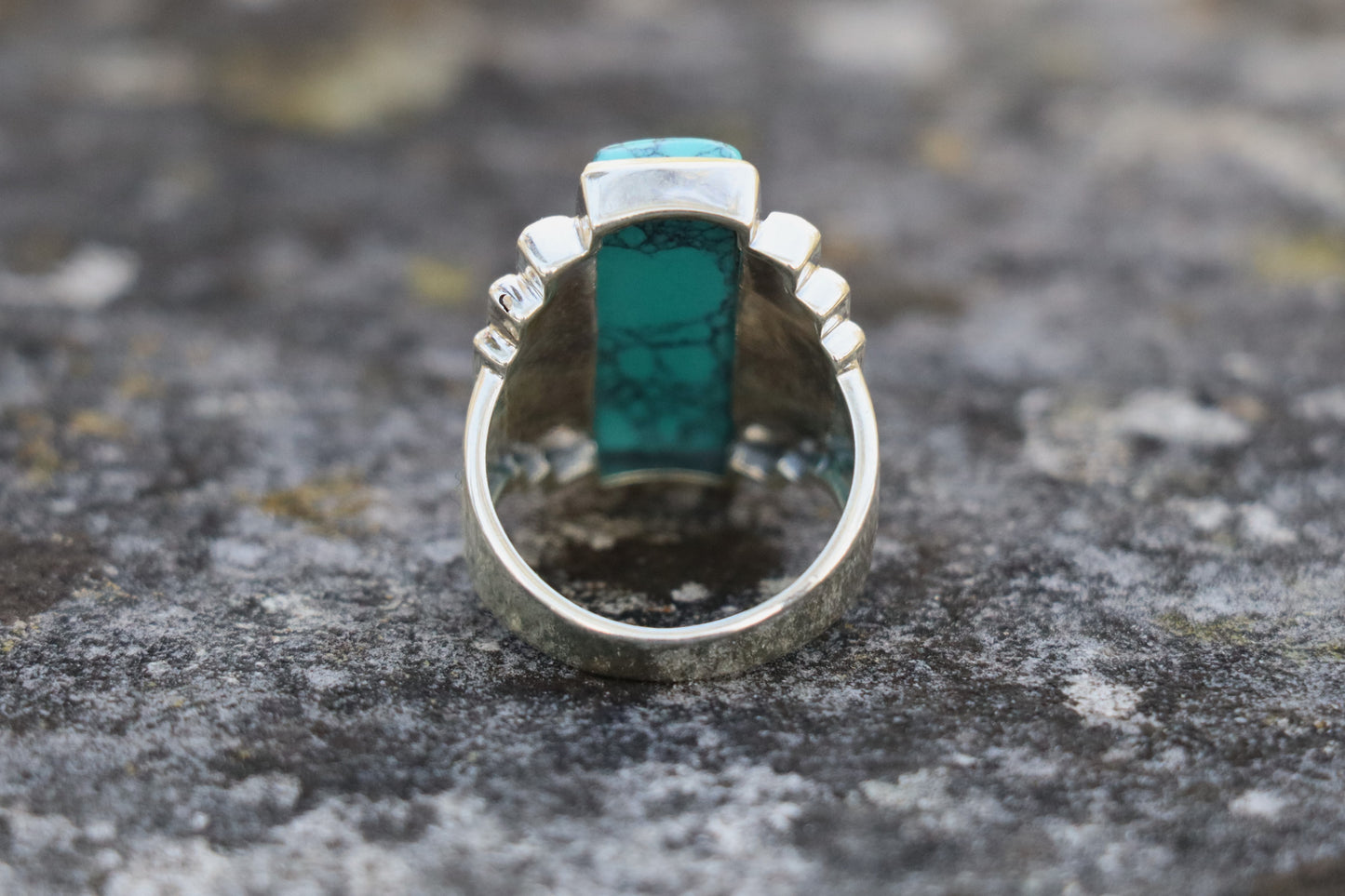 Back view of the Turquoise Statement Ring, revealing the solid 925 Sterling Silver band. Symbolizes grounded protection and a stable energetic foundation.