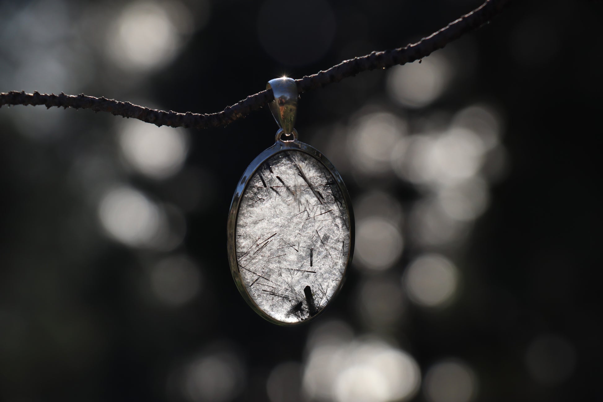 Handcrafted Silver Pendant with Rutilated Quartz. Witchy jewelry for spiritual growth.