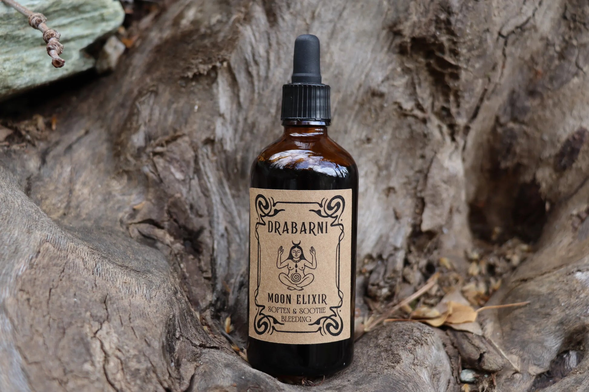 Drabarni Moon Elixir herbal tincture for period pain relief and bleeding support, featuring Cramp Bark, Black Cohosh, and more.