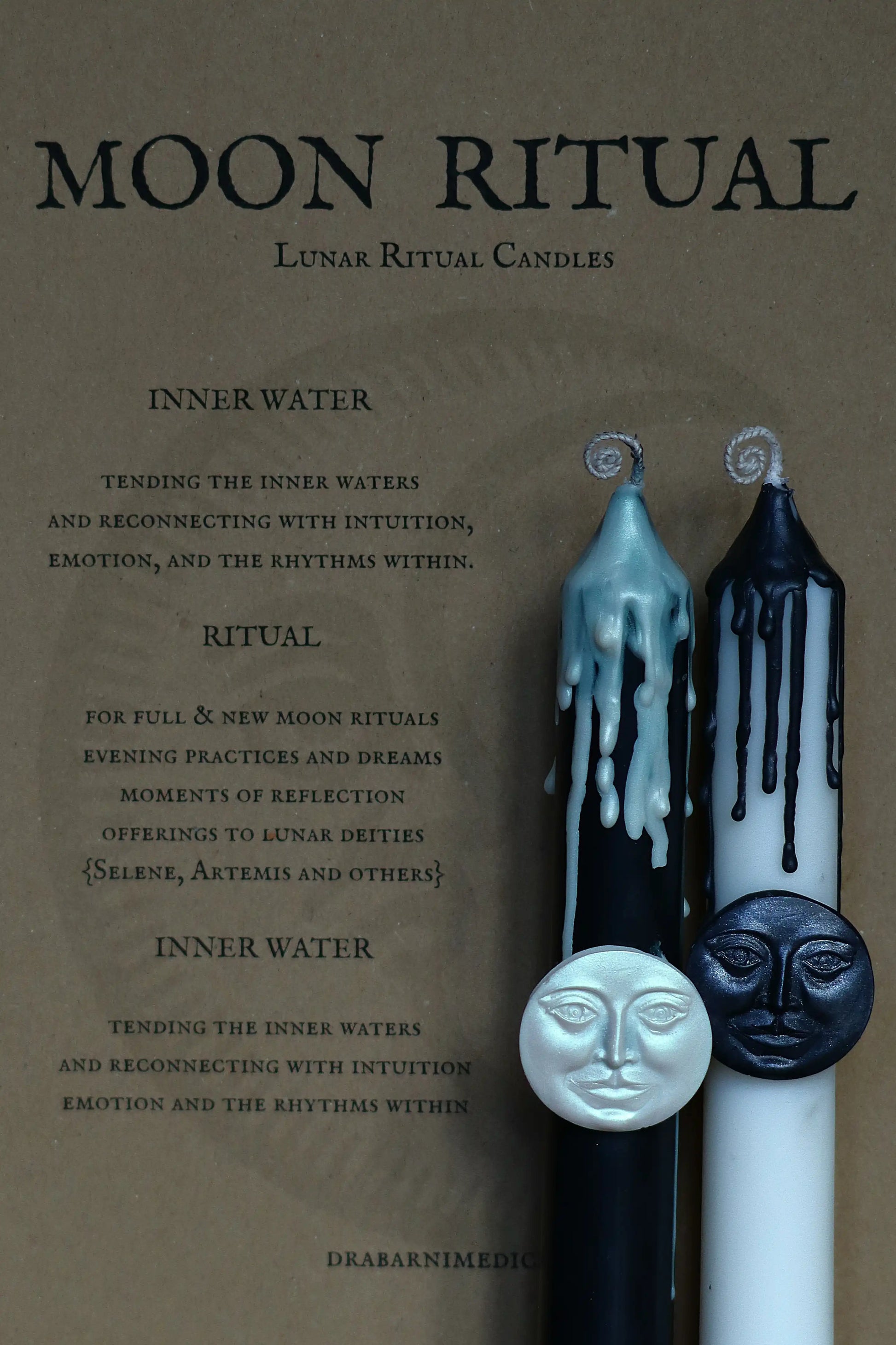 Moon Cycle Ritual Magic Candles set for New Moon manifestation and Full Moon release. Pair of botanical soy and beeswax candles with silver moon face emblems, ideal for lunar cycle rituals, altar supplies, and spiritual meditation. Perfect for honoring Selene and Artemis, intention setting, and divine feminine ceremonies.
